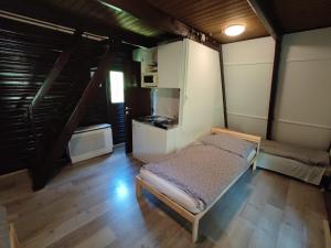 Posteľ alebo postele v izbe v ubytovaní Mátrai Vándor Apartmanok