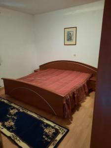 Postel nebo postele na pokoji v ubytování Apartman Kapelica