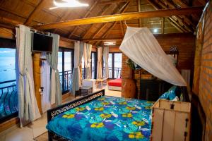 Un pat sau paturi într-o cameră la Hakuna Matata Lodge