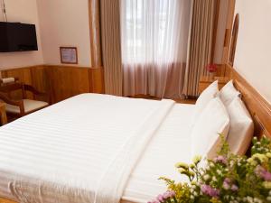Postel nebo postele na pokoji v ubytování MDHOTEL 2