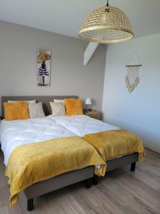 Ένα ή περισσότερα κρεβάτια σε δωμάτιο στο La Mosloise