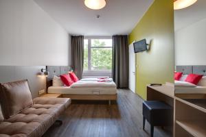 Postel nebo postele na pokoji v ubytování MEININGER Hotel Berlin Mitte