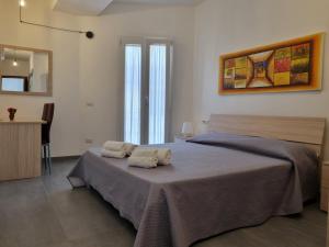 Katil atau katil-katil dalam bilik di Sardiniarooms Tortolì Old Town