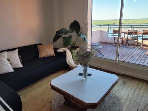 Część wypoczynkowa w obiekcie Vue et terrasse panoramique sur la Baie de Somme