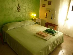 Postel nebo postele na pokoji v ubytování B&B Sunrise