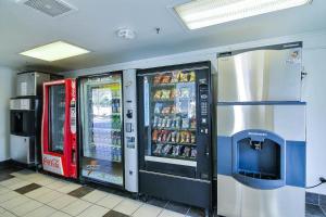 two soda machines are lined up in a store at Motel 6-Ventura, CA - South in Ventura
