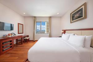 Postelja oz. postelje v sobi nastanitve Sekong Hotel Da Nang