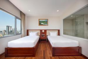 Postelja oz. postelje v sobi nastanitve Sekong Hotel Da Nang