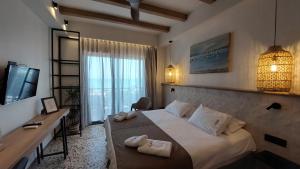 TV a/nebo společenská místnost v ubytování Anetis Hotel