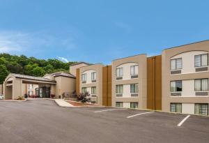 an empty parking lot in front of a building at Sleep Inn Tanglewood in Roanoke