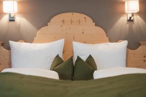 Postel nebo postele na pokoji v ubytování Hotel Kesslwirt