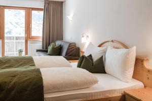 Postel nebo postele na pokoji v ubytování Hotel Kesslwirt