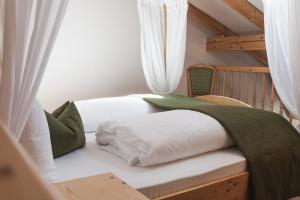 Postel nebo postele na pokoji v ubytování Hotel Kesslwirt