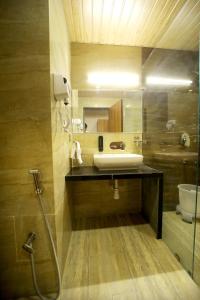a bathroom with a sink and a mirror at The Sky Imperial - Shahi Hotels & Resort in Nāthdwāra