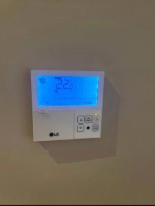 a digital clock on a wall in a room at Cosy appartement à Ain Diab beach in Casablanca