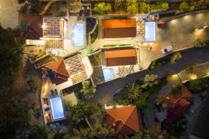 an overhead view of a house with orange roofs at Studios Limnionas in Marathokampos