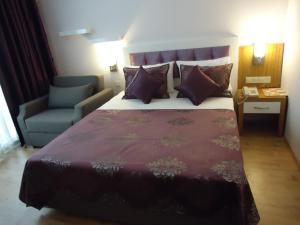 Postel nebo postele na pokoji v ubytování Bilkay Hotel