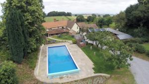 an aerial view of a house with a swimming pool at Castle Of Comfort Hotel in Nether Stowey