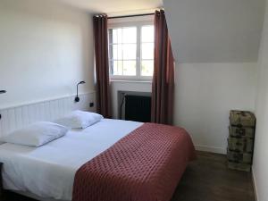 Ένα ή περισσότερα κρεβάτια σε δωμάτιο στο Town house Jumilhac-le-Grand