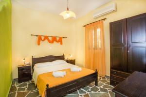 A bed or beds in a room at Ktima Nikola