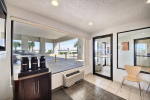 a room with a large window with a view of a parking lot at Motel 6-Laredo, TX - North I-35 in Laredo