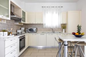 Η κουζίνα ή μικρή κουζίνα στο Amphitrite Villa