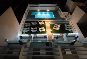 an aerial view of a house with a swimming pool at Nerja VG Hostal Boutique in Nerja