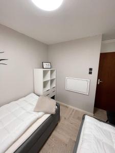 Säng eller sängar i ett rum på THE DUNE by STRANDBERGE - Luxury apartment Veere