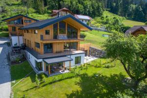 an aerial view of a house on a hill at Neusach64 in Weissensee