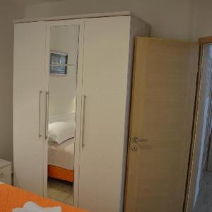 Postel nebo postele na pokoji v ubytování Apartments Leon