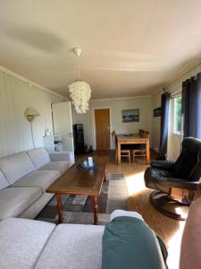 a living room with a couch and a table at Lyngen House in Olderdalen