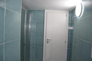 a bathroom with a shower and a glass door at Dimora D’alessandro in Naples +6 photos
