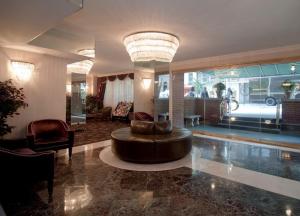 a large living room with a large couch in a room at Murray Hill East Suites - Extended Stay in New York