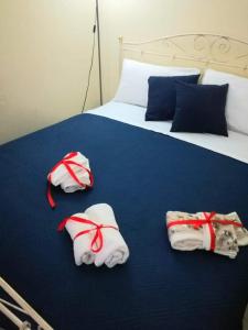 A bed or beds in a room at L 'Alcova Holidays Home CENTRO STORICO