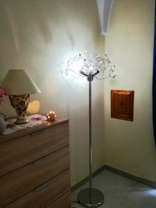 A bed or beds in a room at L 'Alcova Holidays Home CENTRO STORICO