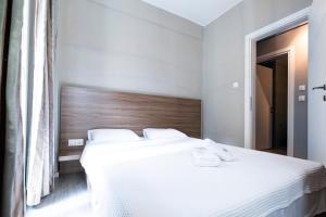 Posteľ alebo postele v izbe v ubytovaní Delmare MQUEEN Apartment