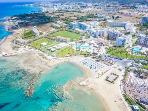 an aerial view of the beach at the resort at Papouis Protaras Hotel in Protaras