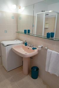 a bathroom with a sink and a mirror at Casa Lalù - Rustic apartment with stunning views in Positano