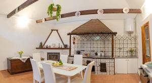 a kitchen and dining room with a table and chairs at Casa Lalù - Rustic apartment with stunning views in Positano