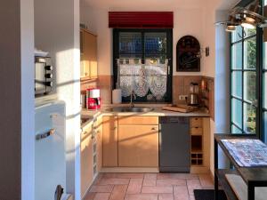 a kitchen with a sink and a window at Ferienhaus Prerow in Prerow +7 photos