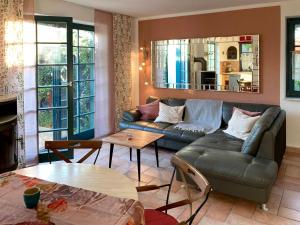 a living room with a couch and a table at Ferienhaus Prerow in Prerow
