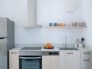 Kuchyňa alebo kuchynka v ubytovaní Etherio Apartment V