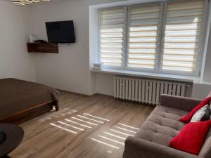 Televízia a/alebo spoločenská miestnosť v ubytovaní M&M apartamenty 2
