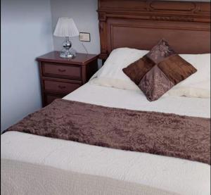 Postel nebo postele na pokoji v ubytování Hostal J.B