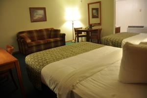 Postel nebo postele na pokoji v ubytování Fort Davidson Hotel