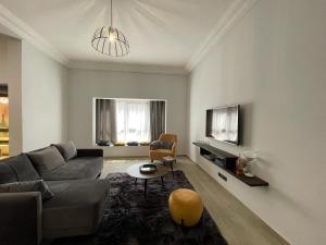 a living room with a couch and a table at BLU Apartments in Bamako