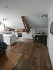 a kitchen and dining room with a table in a room at Le domaine de Moïse in La Fouillade