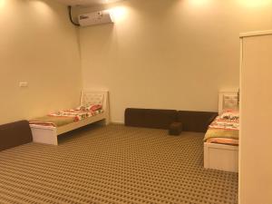 a room with two beds in a room at استراحة الذروة in Abha