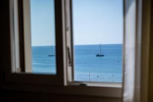 a view of the ocean from a window at Stella Ví in Cefalù +50 photos