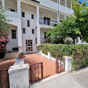 a building with a gate in front of it at Appartamento Corallo in Porto Recanati